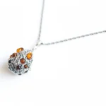 Faberge Inspired Amber Egg Locket Necklace - Exquisite Sterling Silver Pendant with Baltic Amber Accents