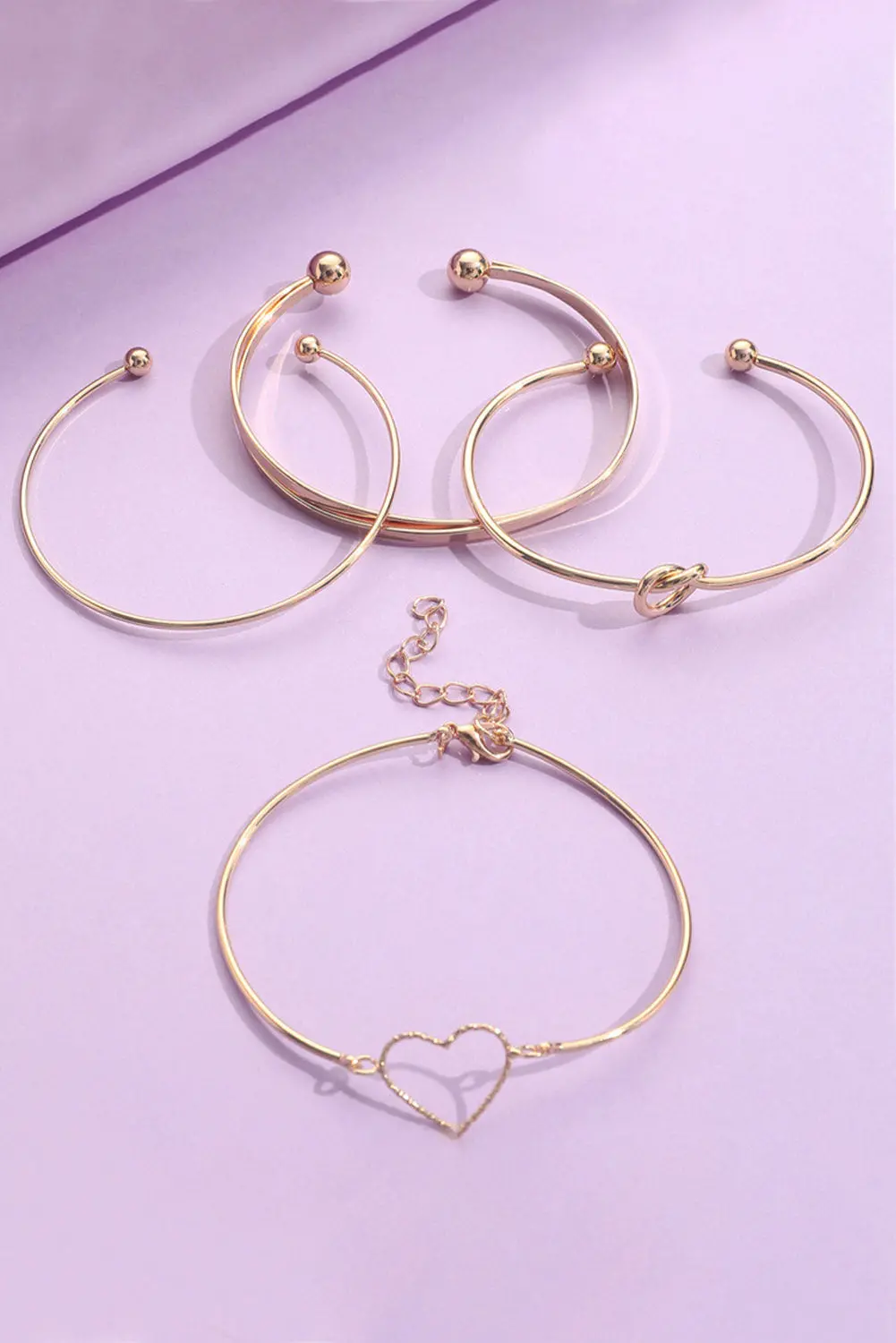 34026348_large.webp Gold Love Geometric Cross Bracelet Set - Stylish, Adjustable, 4-Piece Jewelry Set - Image 1