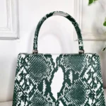 Stylish Faux Leather Fold Over Bag with Bold Snake Print - Durable & Trendy Handbag