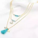 TASSELS AND TRINKETS Layered Necklace - Multi-Layered Fashion Jewelry with Turquoise Beads & Handmade Tassel - Image 2